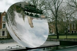 Curved reflective surface of Anish Kapoor’s Sky Mirror in Nottingham.